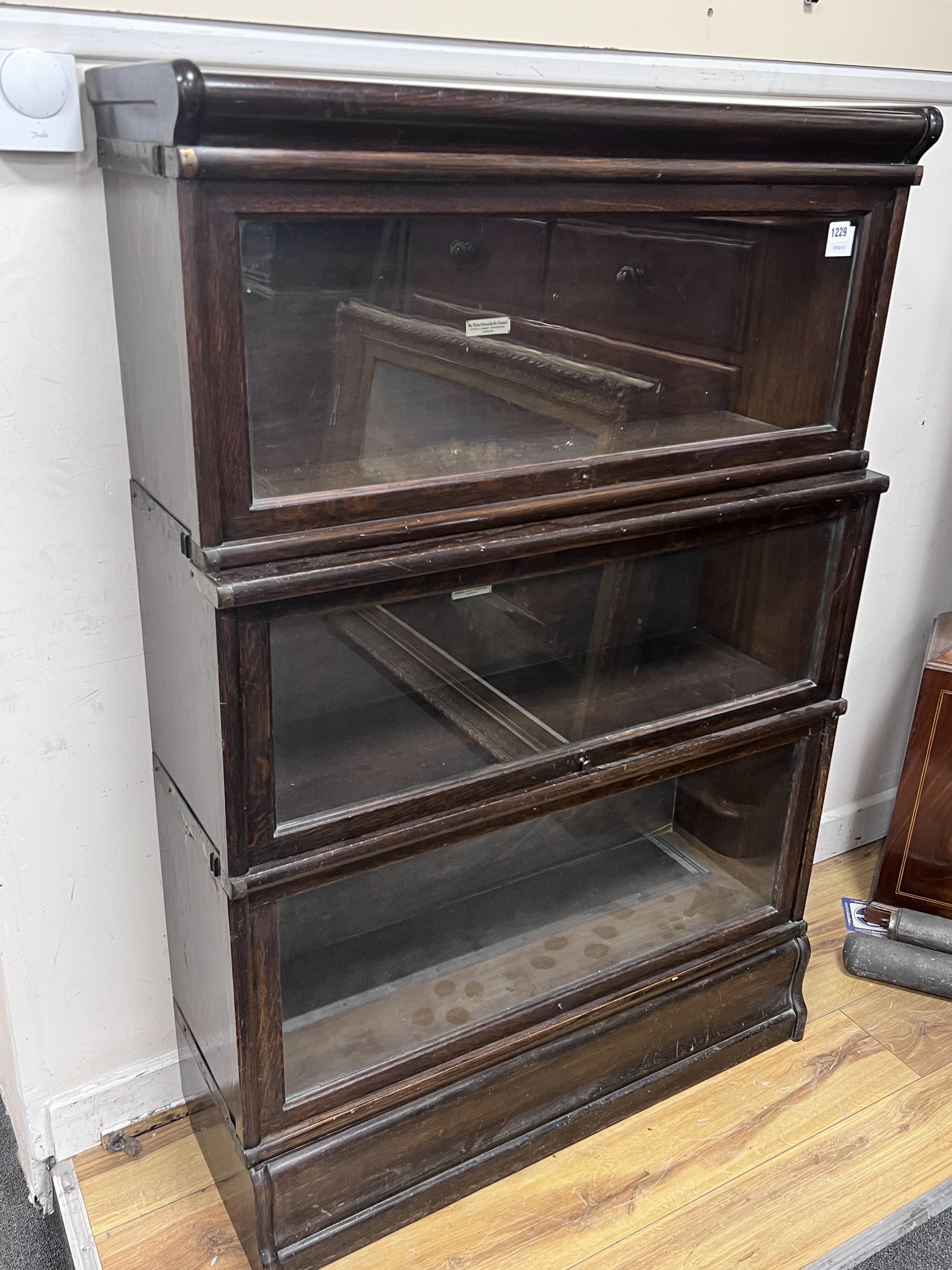 A Globe Wernicke oak three sectional bookcase, length 87cm, depth 32cm, height 129cm